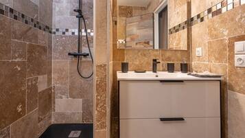 Shower, hair dryer, towels, toilet paper