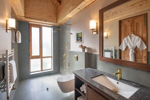 Shower, designer toiletries, hair dryer, bathrobes