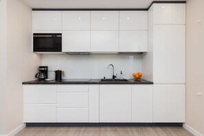 Fridge, microwave, stovetop, coffee/tea maker