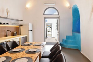 Exclusive Suite, 3 Bedrooms | Living area | 45-inch Smart TV with cable channels, TV, Netflix - Captain's House Suites (Santorini)