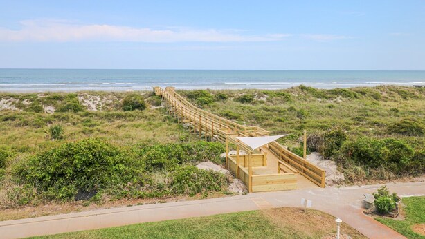 A wooden boardwalk leading to a beach with a dune system and a clear view of the ocean. - Enjoy the Sunrise and the Sunset from your very own Balcony! (St. Augustine)