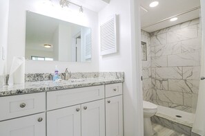 Bathtub, hair dryer, towels, soap