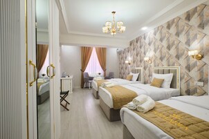 Deluxe Room, 3 Twin Beds | In-room safe, desk, laptop workspace, soundproofing