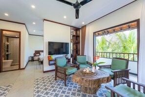 Junior Room, 1 Queen Bed, Balcony | Living room | 27-inch LCD TV with satellite channels