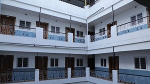 A multi-story building with balconies, railings, and windows. - kapila residency (Bengaluru)