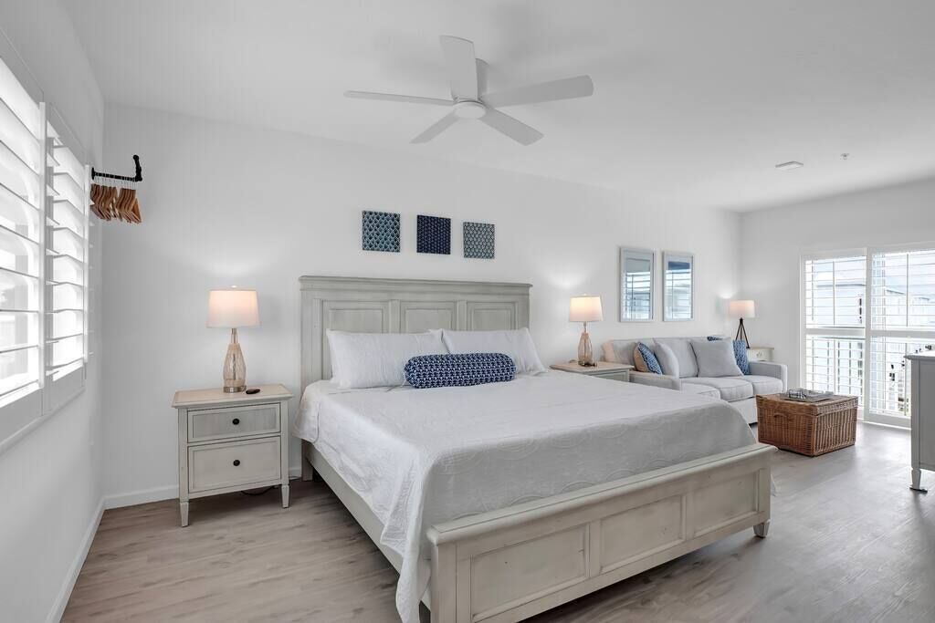 Master bedroom with King bed; Ceiling fan; Large Dresser and clothing rack