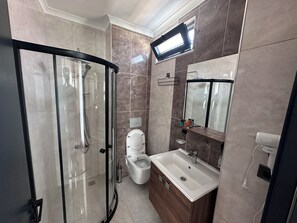 Deluxe Suite, 1 Bedroom, Private Bathroom, Partial Sea View | Bathroom | Hydromassage showerhead, hair dryer, slippers, towels - Star Suit Hotel (Trabzon)
