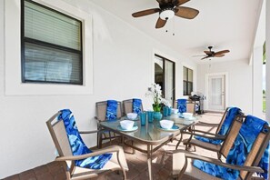 Enjoy meals in this dining area with a glass-top table and six comfortable chairs.