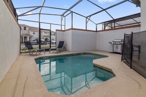 Relax by the pool surrounded by a spacious deck and comfortable lounge chairs.