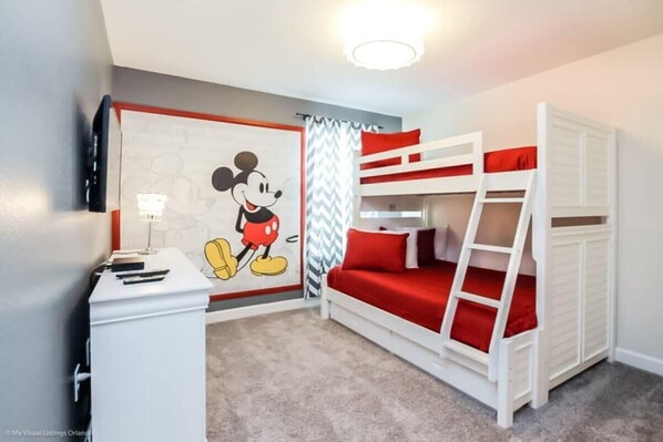 A room with bunk beds, a desk, and a Mickey Mouse mural. - Mickey! Ping Pong! Resort 9 Mi 2 Disney! 9022 (Davenport)