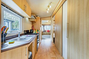 Fridge, microwave, oven, stovetop - Sandcastle Mobility Lodge 2 Bedroom Beach Caravan Mudeford (Mudeford, Christchurch)