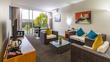 Luxury Suite | Living area | Flat-screen TV