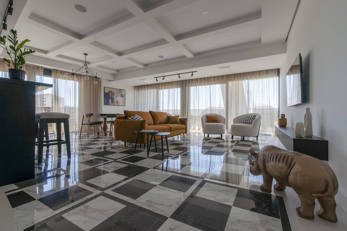 Royal Apartment, 1 Bedroom, 2 Bathrooms, Sea View | Living area | 32-inch LCD TV with cable channels