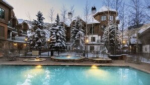 A pool area with a hot tub, surrounded by snow-covered trees and buildings. - Hyatt Mountain Lodge Beaver Creek, Colorado - Prime Ski & Summer Weeks Available (Avon)