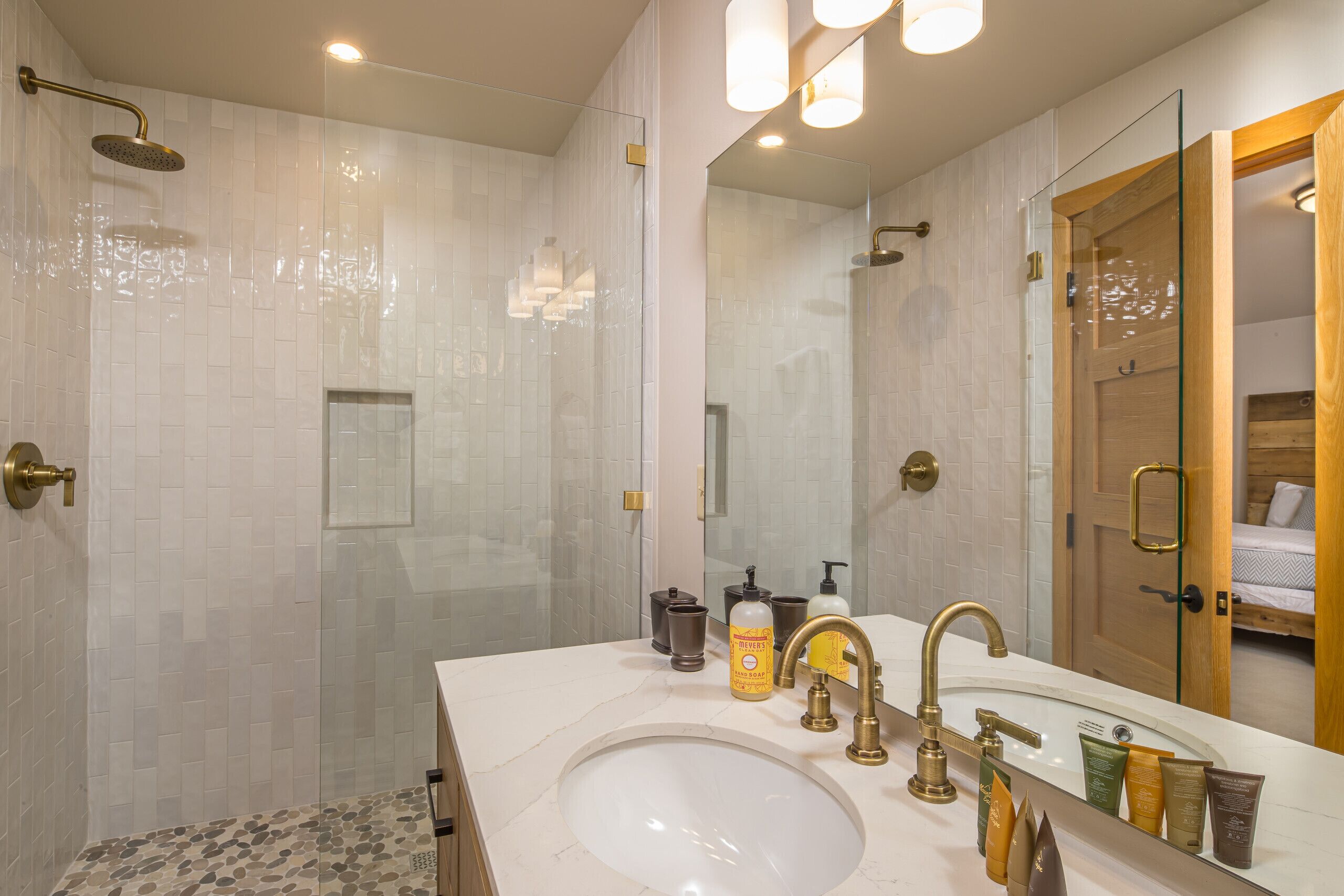 Bathtub, hair dryer, towels, toilet paper