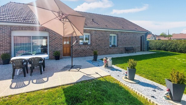 A brick house with a patio, outdoor furniture, and a large umbrella. - Awesome home in Quoux-Haut-Maînil with WiFi (Quoux-Haut-Maînil)