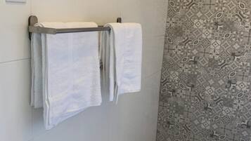 Shower, towels, soap, shampoo