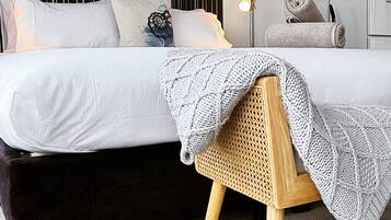 Premium bedding, blackout curtains, iron/ironing board, free WiFi