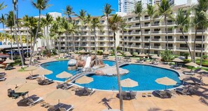 A resort with a central pool, multiple balconies, and palm trees. - Luxury Resort on the Puerta Vallarta Beach (Puerto Vallarta)