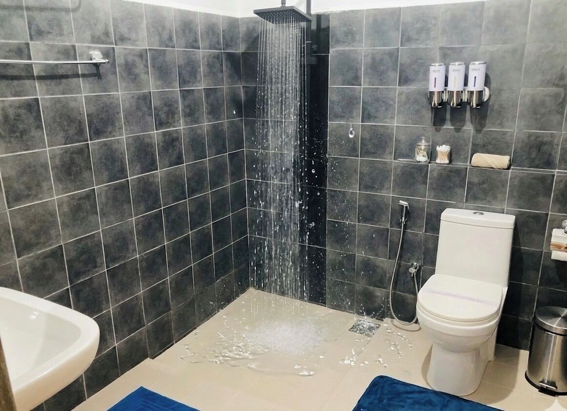 Shower, designer toiletries, hair dryer, bathrobes
