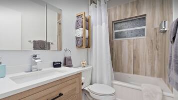 Jetted bath, hair dryer, towels, soap