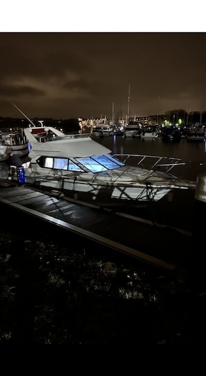 Boats docked in a serene marina setting.