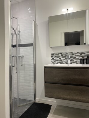 Shower, towels, soap, toilet paper