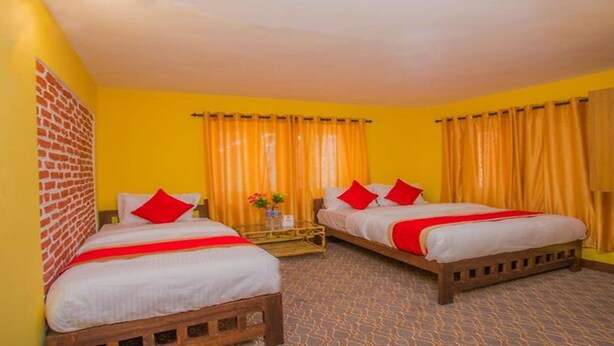 A hotel room with two beds, yellow walls, and orange curtains. - MeroStay 154 White & Peace (Lalitpur)
