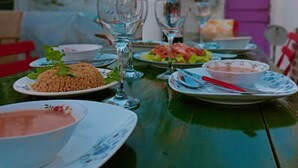 A table set with plates of food, glasses, and cutlery. - Mell10 House (Urla)