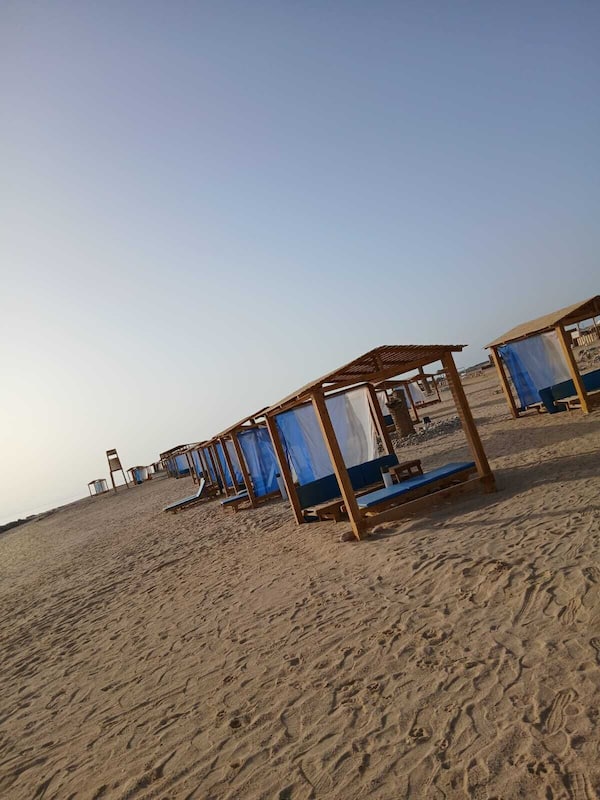 Private beach, white sand, sun-loungers, beach umbrellas