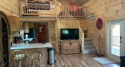 Cozy hillside retreat near trout stream, public forest and UTV trails.