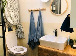 Shower, hair dryer, towels, soap