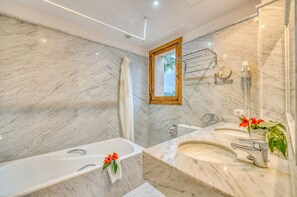 Bathtub, hair dryer, towels