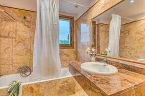 Bathtub, hair dryer, towels