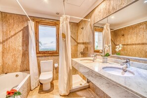 Bathtub, hair dryer, towels