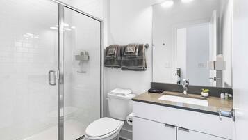 Shower, hair dryer, towels, soap