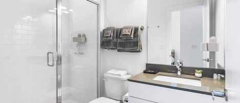 Shower, hair dryer, towels, soap