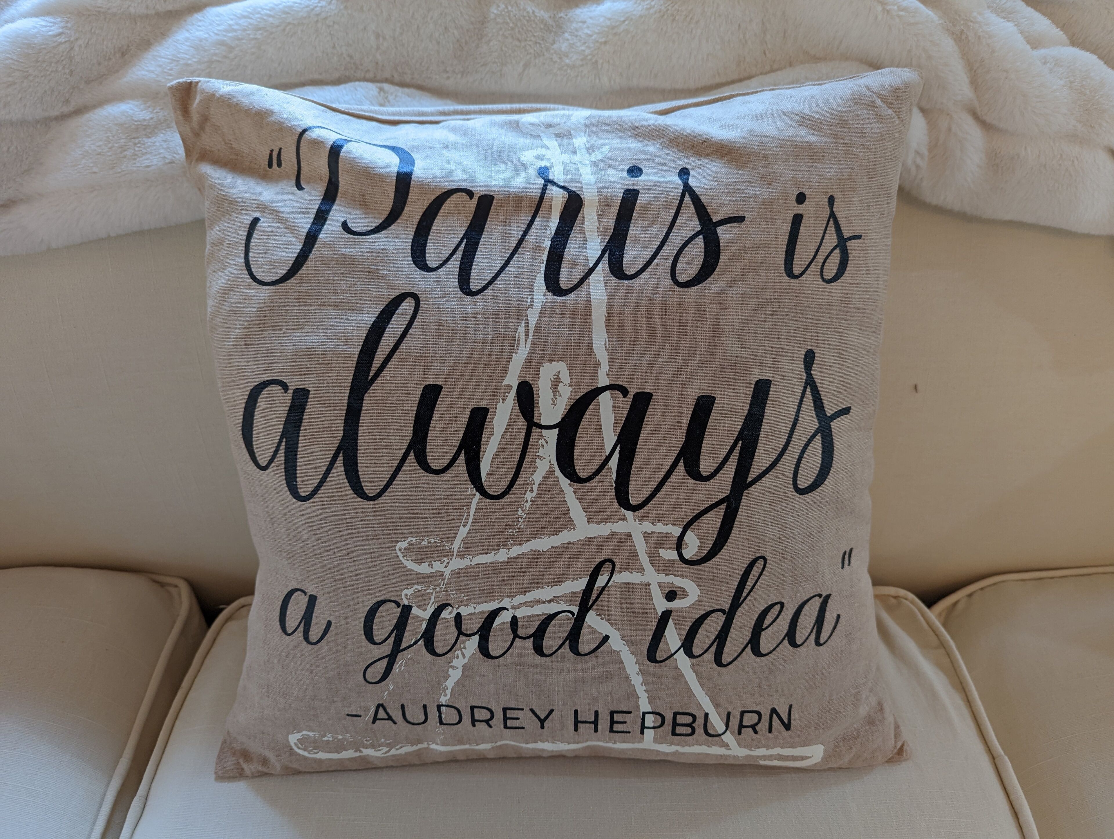 A pillow with a quote by Audrey Hepburn.