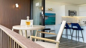Enjoy a comfortable stay in this stylish room featuring a balcony, kitchenette, and flat-screen TV.