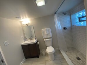 Shower, hair dryer, towels, soap