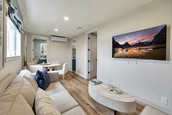 This unit features a comfortable living area with a flat-screen TV