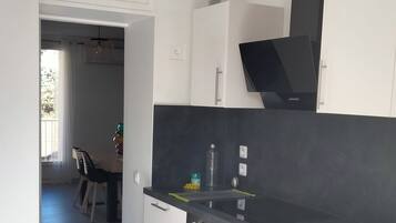 Microwave, oven, dishwasher, dining tables