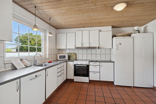 Fridge, stovetop, dishwasher, coffee/tea maker