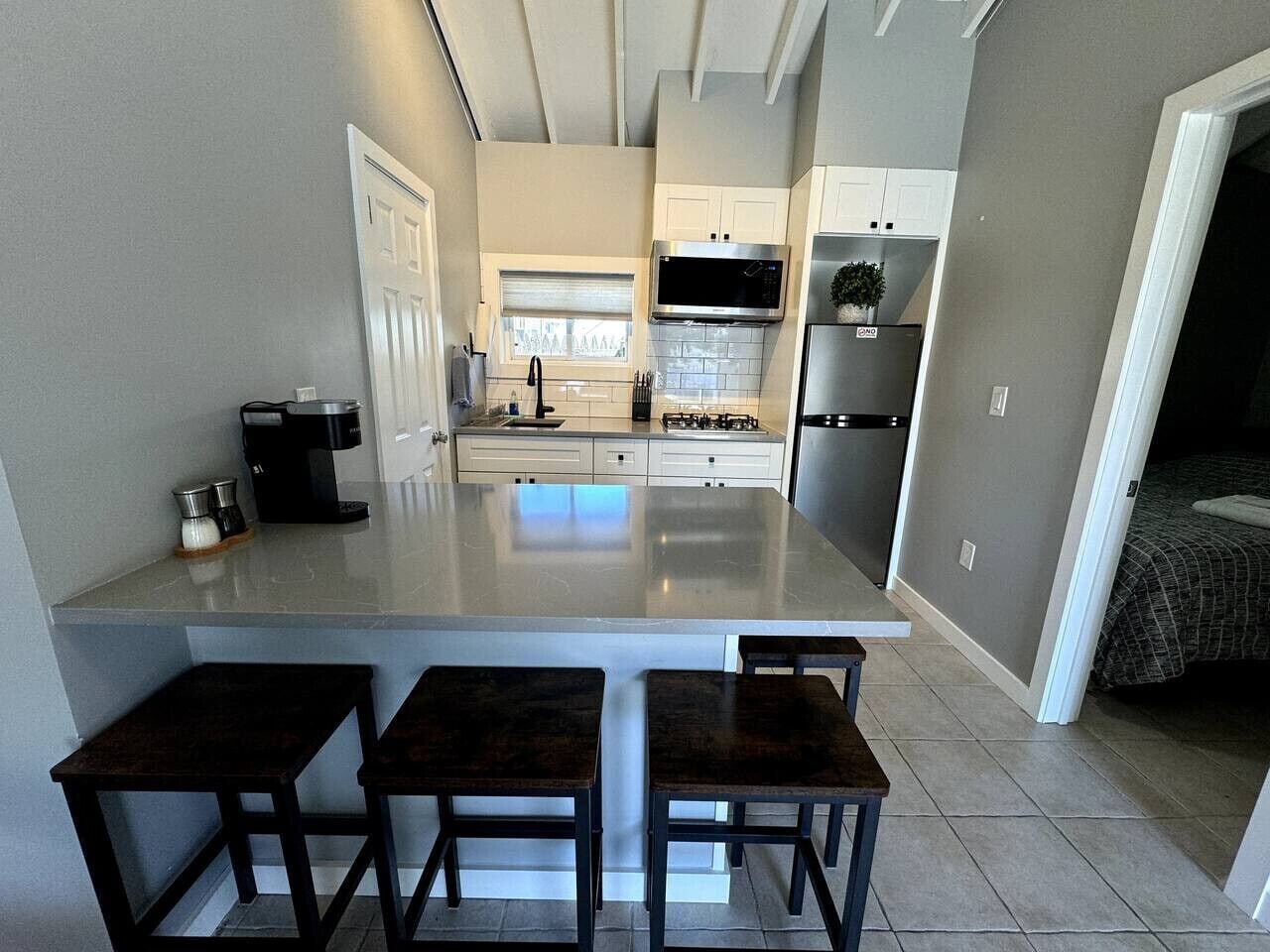 Fridge, microwave, stovetop, coffee/tea maker