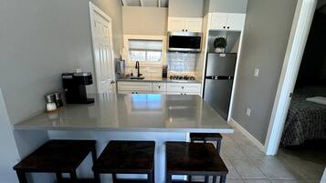 Fridge, microwave, stovetop, coffee/tea maker
