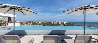 ACROSS THE STREET FROM OCEAN! Stunning Condo with Private Pool/patio