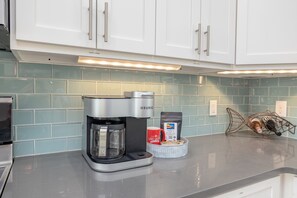 Coffee/tea maker, fridge, microwave, oven