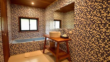 Separate bathtub and shower, rainfall showerhead, free toiletries