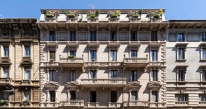 A multi-story building with a classical architectural style, featuring symmetrical balconies and large windows. - Le Dimore Suites Milano (Milan)