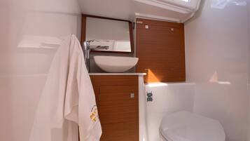 Shower, towels, soap, toilet paper